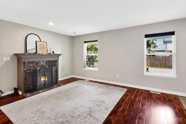 8419 Double Ditch Rd, Lynden, WA 98264 - unfurnished living room featuring a fireplace with flush hearth, wood finished floors, and recessed lighting