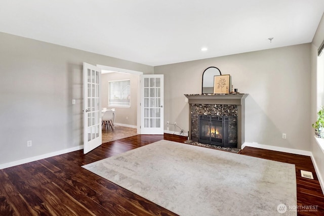8419 Double Ditch Rd, Lynden, WA 98264 - living room featuring french doors, a premium fireplace, wood finished floors, and recessed lighting