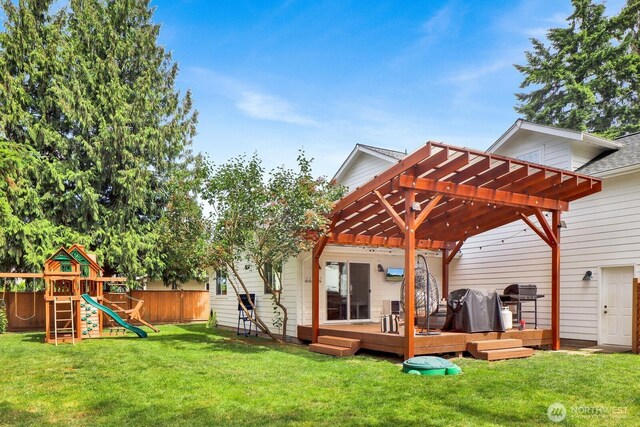 8419 Double Ditch Rd, Lynden, WA 98264 - rear view of house with a pergola, a deck, and a playground