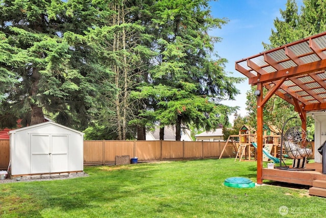 8419 Double Ditch Rd, Lynden, WA 98264 - fenced backyard with a storage unit, a playground, and a pergola