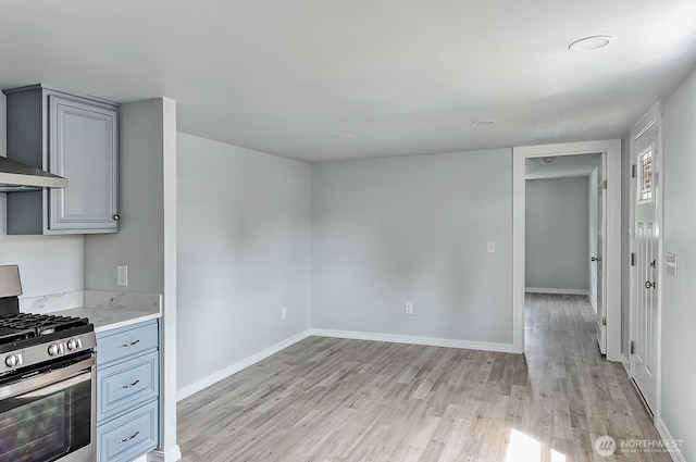 1942 Trigg Rd Unit 38, Ferndale, WA 98248 - kitchen featuring stainless steel range with gas cooktop, gray cabinetry, and light wood-type flooring