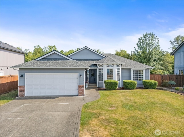 209 Groff Ave NW, Orting, WA 98360 - ranch-style house featuring concrete driveway, brick siding, an attached garage, and roof with shingles