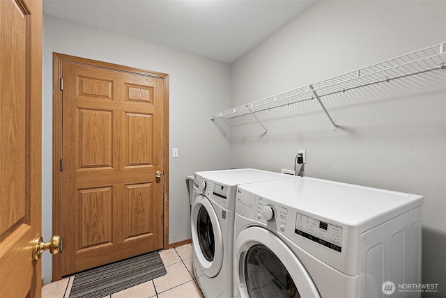 209 Groff Ave NW, Orting, WA 98360 - laundry area featuring independent washer and dryer and light tile patterned flooring