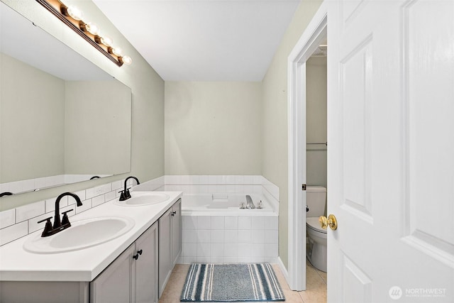 209 Groff Ave NW, Orting, WA 98360 - full bath featuring tile patterned floors, a garden tub, and double vanity