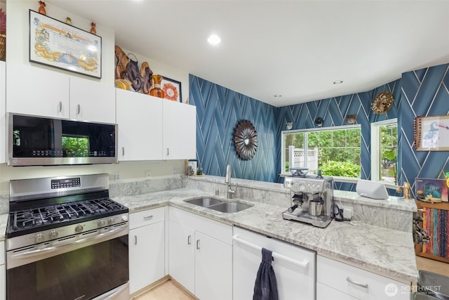 4714 Fairwood Blvd NE Unit 201, Tacoma, WA 98422 - kitchen featuring stainless steel appliances, light stone countertops, white cabinets, and recessed lighting