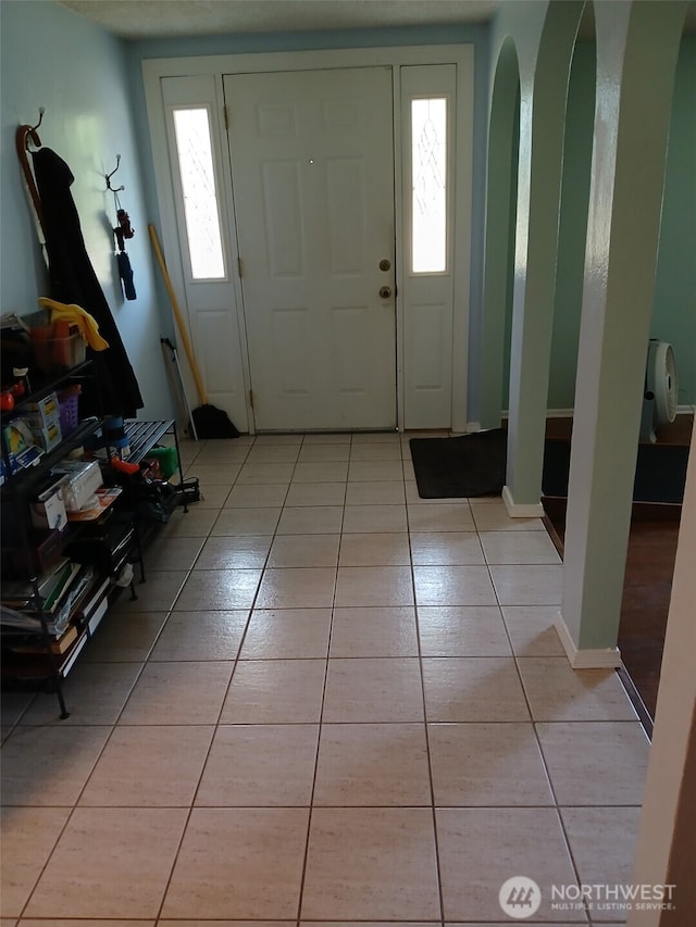 737 3rd Ave SE, Pacific, WA 98047 - entrance foyer featuring light tile patterned floors and healthy amount of natural light