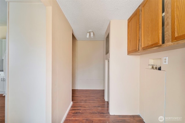 1303 Craig St W, Moses Lake, WA 98837 - hall with a textured ceiling and dark wood-type flooring
