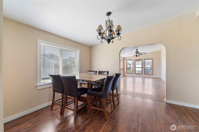 1303 Craig St W, Moses Lake, WA 98837 - dining area with arched walkways, a chandelier, and dark wood-style flooring