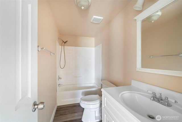 1303 Craig St W, Moses Lake, WA 98837 - full bathroom with vanity, washtub / shower combination, and wood finished floors