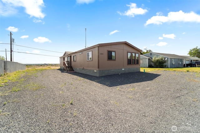 1303 Craig St W, Moses Lake, WA 98837 - view of property exterior featuring crawl space
