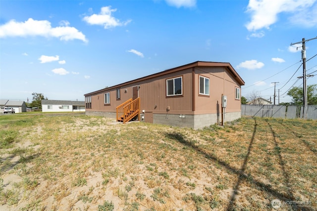 1303 Craig St W, Moses Lake, WA 98837 - rear view of house with crawl space