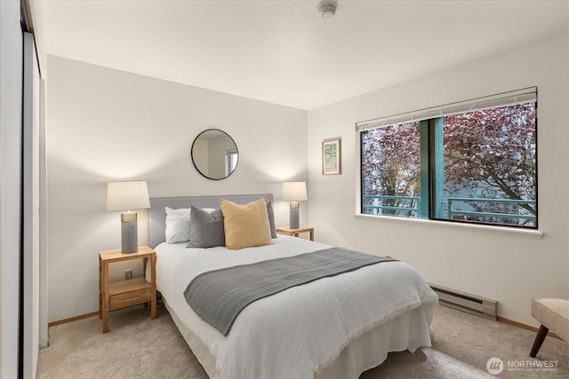 3256 SW Avalon St Unit 304, Seattle, WA 98126 - bedroom with baseboard heating and carpet floors