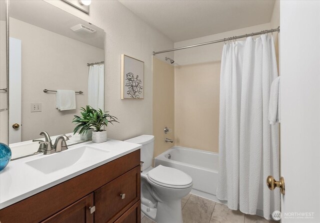 3256 SW Avalon St Unit 304, Seattle, WA 98126 - bathroom with vanity, shower / bath combo with shower curtain, and tile patterned floors