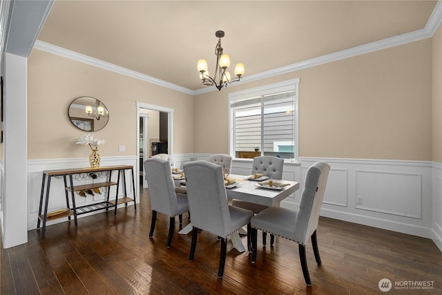21230 SE 258th Pl, Maple Valley, WA 98038 - dining space featuring a chandelier, crown molding, wainscoting, and dark wood finished floors