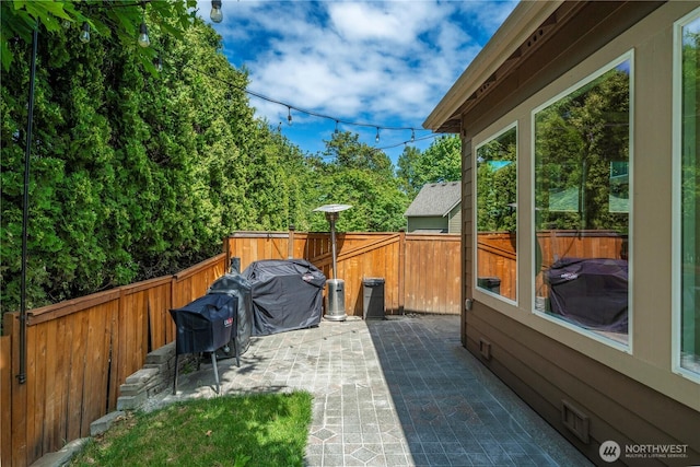 21230 SE 258th Pl, Maple Valley, WA 98038 - fenced backyard with a patio area and grilling area