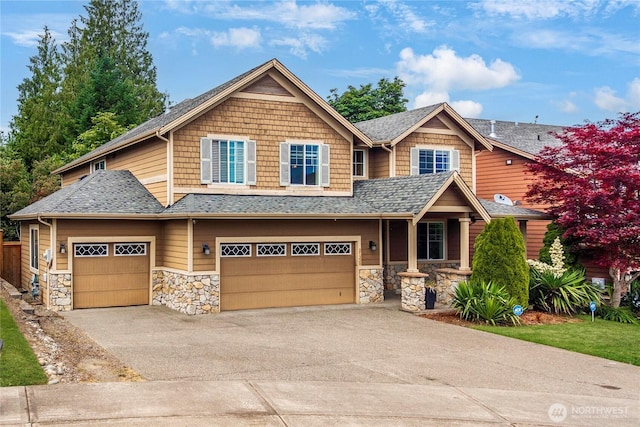 21230 SE 258th Pl, Maple Valley, WA 98038 - craftsman house with stone siding, driveway, and roof with shingles