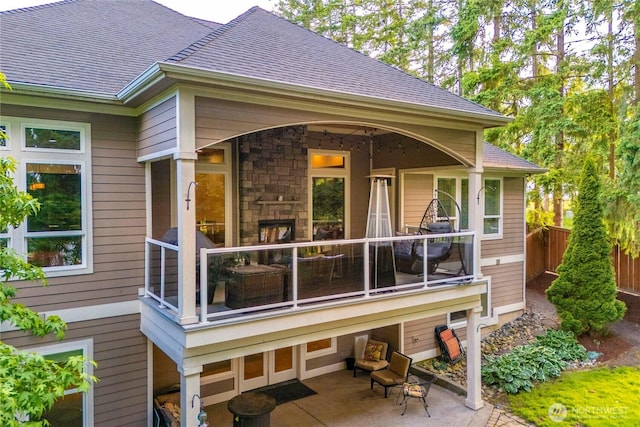 8003 113th Street Ct E, Puyallup, WA 98373 - rear view of property featuring roof with shingles and stone siding