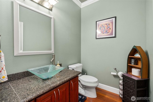 8003 113th Street Ct E, Puyallup, WA 98373 - bathroom featuring crown molding, vanity, and wood finished floors