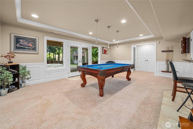 8003 113th Street Ct E, Puyallup, WA 98373 - recreation room with a tray ceiling, a decorative wall, light colored carpet, french doors, and a wainscoted wall