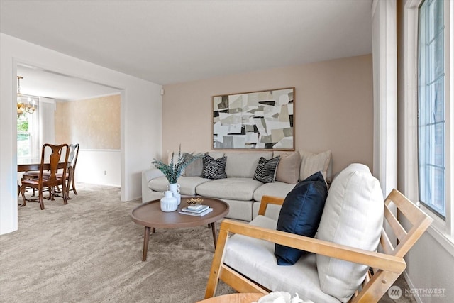 1175 SW Lopez Dr, Oak Harbor, WA 98277 - carpeted living area with a chandelier