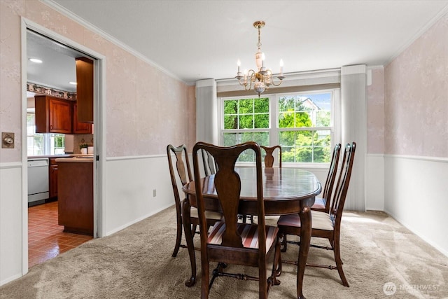1175 SW Lopez Dr, Oak Harbor, WA 98277 - dining room featuring a chandelier, light colored carpet, healthy amount of natural light, and ornamental molding