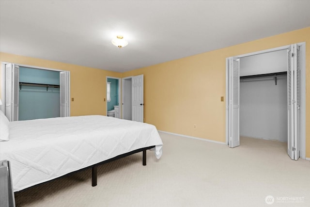 1175 SW Lopez Dr, Oak Harbor, WA 98277 - bedroom featuring two closets and light colored carpet