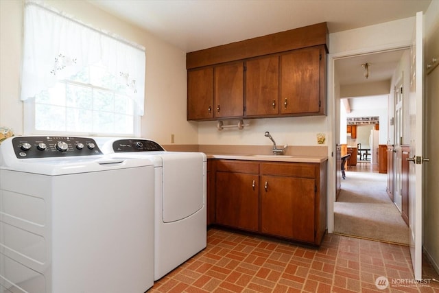 1175 SW Lopez Dr, Oak Harbor, WA 98277 - laundry room featuring independent washer and dryer, brick patterned flooring, and cabinet space