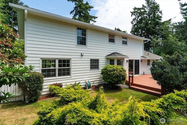 1175 SW Lopez Dr, Oak Harbor, WA 98277 - back of property with a deck and a lawn