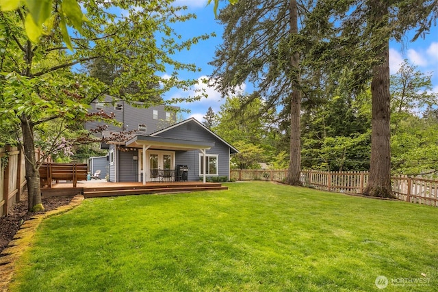 2441 NE 182nd St, Shoreline, WA 98155 - back of house featuring french doors, a fenced backyard, and a wooden deck