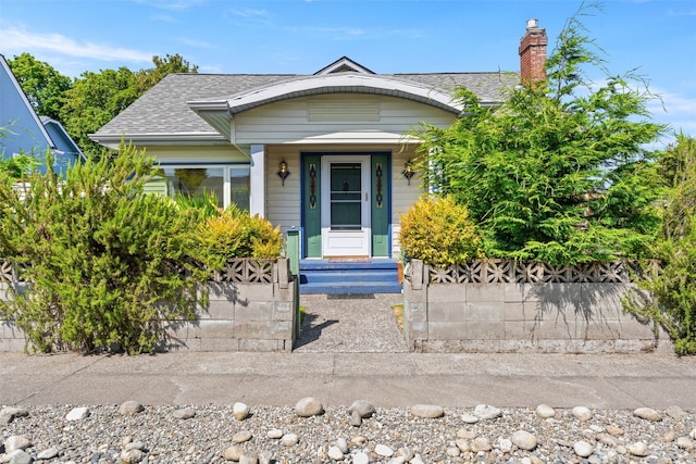 2718 N Alder St, Tacoma, WA 98407 - view of front facade with a shingled roof and a chimney