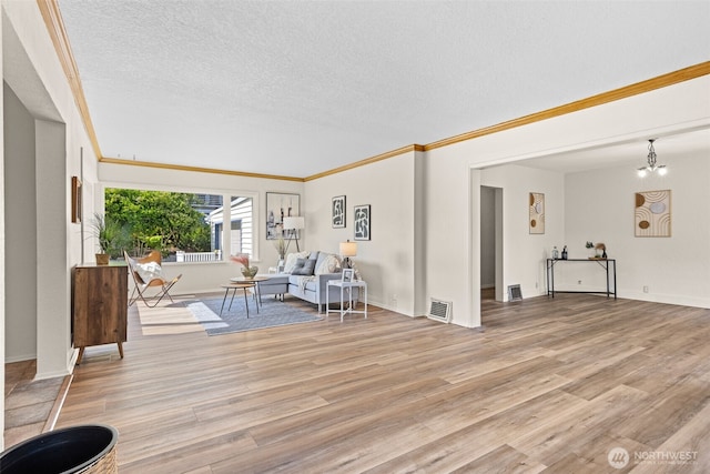 2718 N Alder St, Tacoma, WA 98407 - living area featuring wood finished floors, a textured ceiling, and ornamental molding