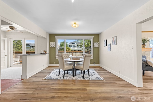2718 N Alder St, Tacoma, WA 98407 - dining space with plenty of natural light, a ceiling fan, and wood finished floors