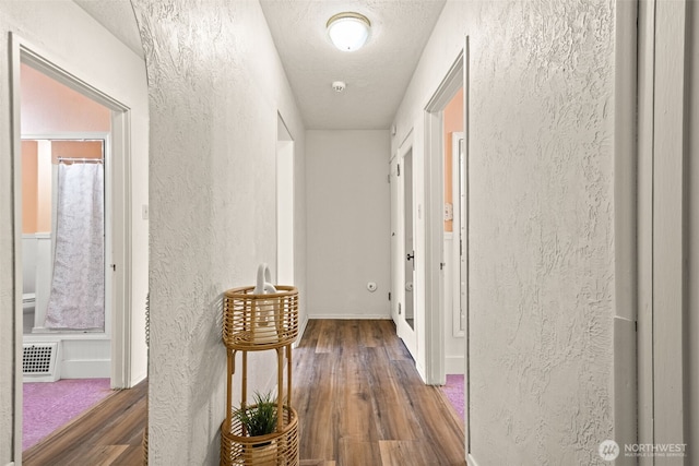 2718 N Alder St, Tacoma, WA 98407 - corridor featuring a textured wall, wood finished floors, and a textured ceiling
