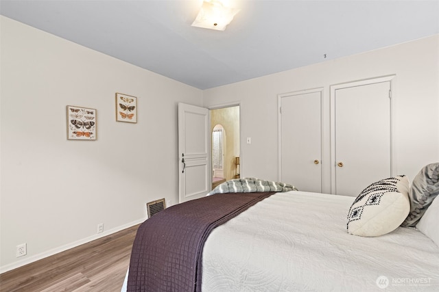 2718 N Alder St, Tacoma, WA 98407 - bedroom with wood finished floors and baseboards