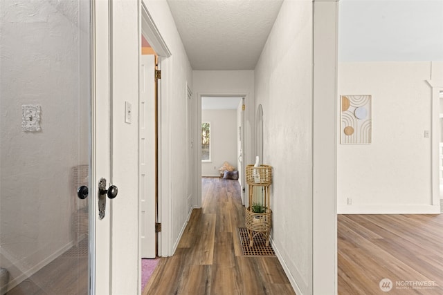 2718 N Alder St, Tacoma, WA 98407 - hall with wood finished floors and a textured ceiling