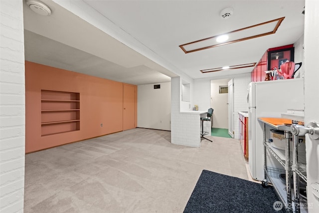 2718 N Alder St, Tacoma, WA 98407 - finished below grade area with built in features, light colored carpet, and freestanding refrigerator