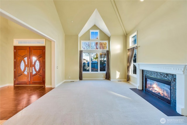 14329 SE 84th Ct, Newcastle, WA 98059 - unfurnished living room featuring high vaulted ceiling, a high end fireplace, and tile patterned floors