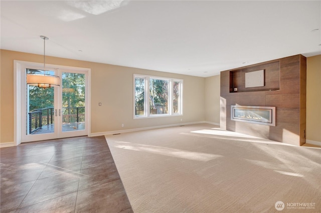 14329 SE 84th Ct, Newcastle, WA 98059 - unfurnished living room with healthy amount of natural light, a large fireplace, and tile patterned floors