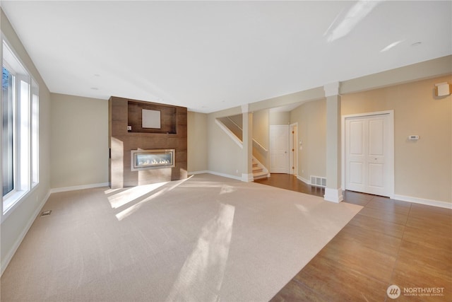 14329 SE 84th Ct, Newcastle, WA 98059 - unfurnished living room featuring stairs and a fireplace