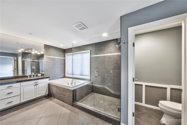 14329 SE 84th Ct, Newcastle, WA 98059 - full bath featuring tile patterned flooring, vanity, a garden tub, and a stall shower