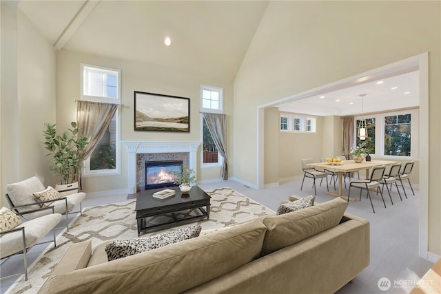 14329 SE 84th Ct, Newcastle, WA 98059 - living area with high vaulted ceiling, a high end fireplace, healthy amount of natural light, and recessed lighting