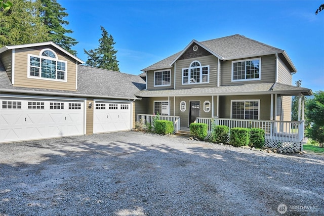 17325 Topaz Loop SE, Yelm, WA 98597 - view of front of property with a porch, driveway, a garage, and a shingled roof