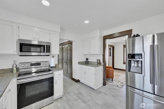 17325 Topaz Loop SE, Yelm, WA 98597 - kitchen with appliances with stainless steel finishes, white cabinets, recessed lighting, and light countertops