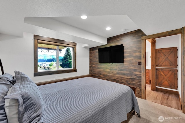 17325 Topaz Loop SE, Yelm, WA 98597 - bedroom with wood walls, recessed lighting, an accent wall, and wood finished floors