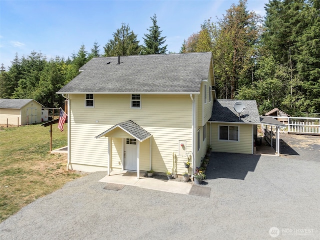 253 Kruger Rd Unit B, Onalaska, WA 98570 - view of front of home with a front yard, roof with shingles, and driveway