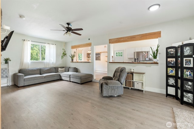 253 Kruger Rd Unit B, Onalaska, WA 98570 - living area featuring a ceiling fan and light wood-style flooring
