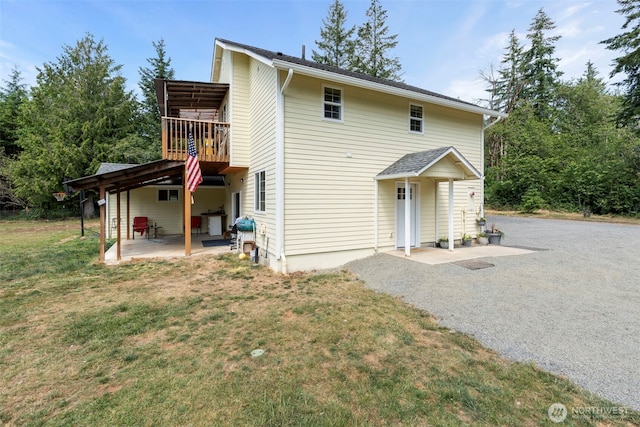 253 Kruger Rd Unit B, Onalaska, WA 98570 - rear view of property with a patio and a lawn