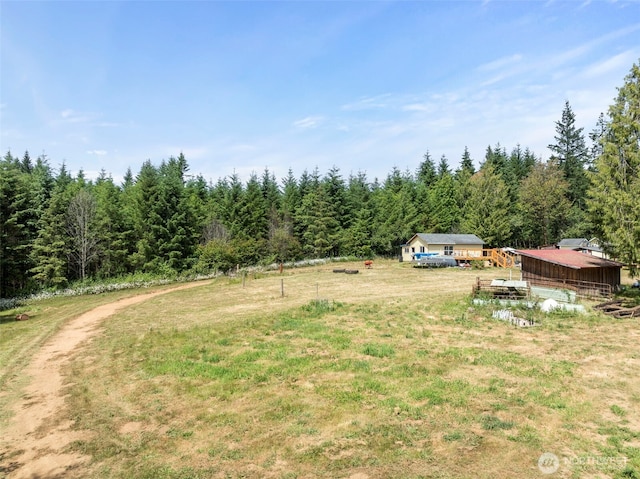 253 Kruger Rd Unit B, Onalaska, WA 98570 - view of grassy yard featuring a wooded view