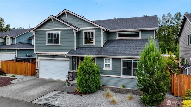 16311 5th Dr SE, Bothell, WA 98012 - craftsman house featuring a garage, concrete driveway, roof with shingles, and stone siding