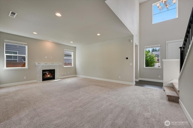 16311 5th Dr SE, Bothell, WA 98012 - unfurnished living room with stairs, carpet floors, plenty of natural light, recessed lighting, and a chandelier
